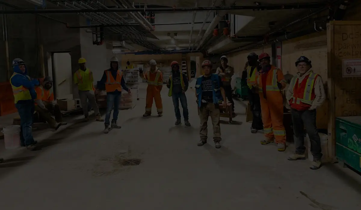 Darwin Concrete Specialist team members working on a concrete finish
