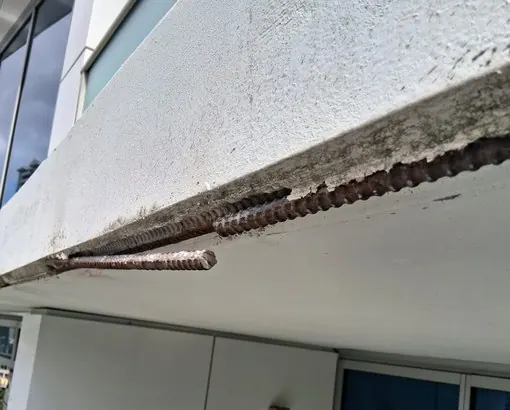Exposed reinforcing steel and a deteriorated edge
